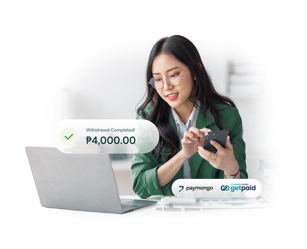 Employee using PayMongo and GetPaid Earned Wage Access app on smartphone with withdrawal confirmation ₱4,000. Seamless payroll benefit for merchants offering on-demand, debt-free salary advances.